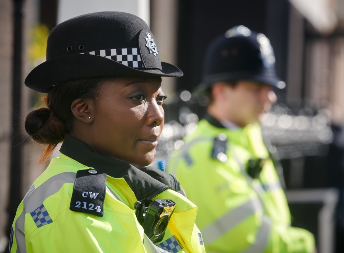 woman police officer standing traffic stop