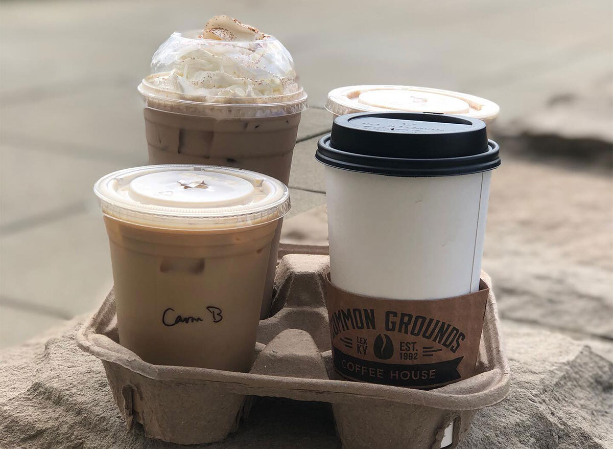 three takeout coffees in a to go container