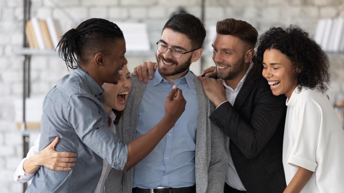 Group of Friends Laughing and Hugging