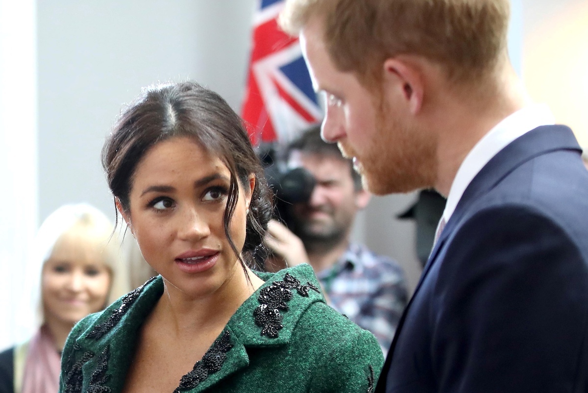 Meghan, Duchess of Sussex (L) and Britain's Prince Harry, Duke of Sussex,