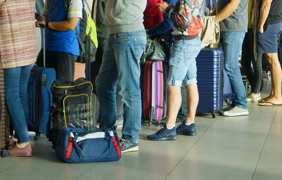 Passengers waiting at airport gate