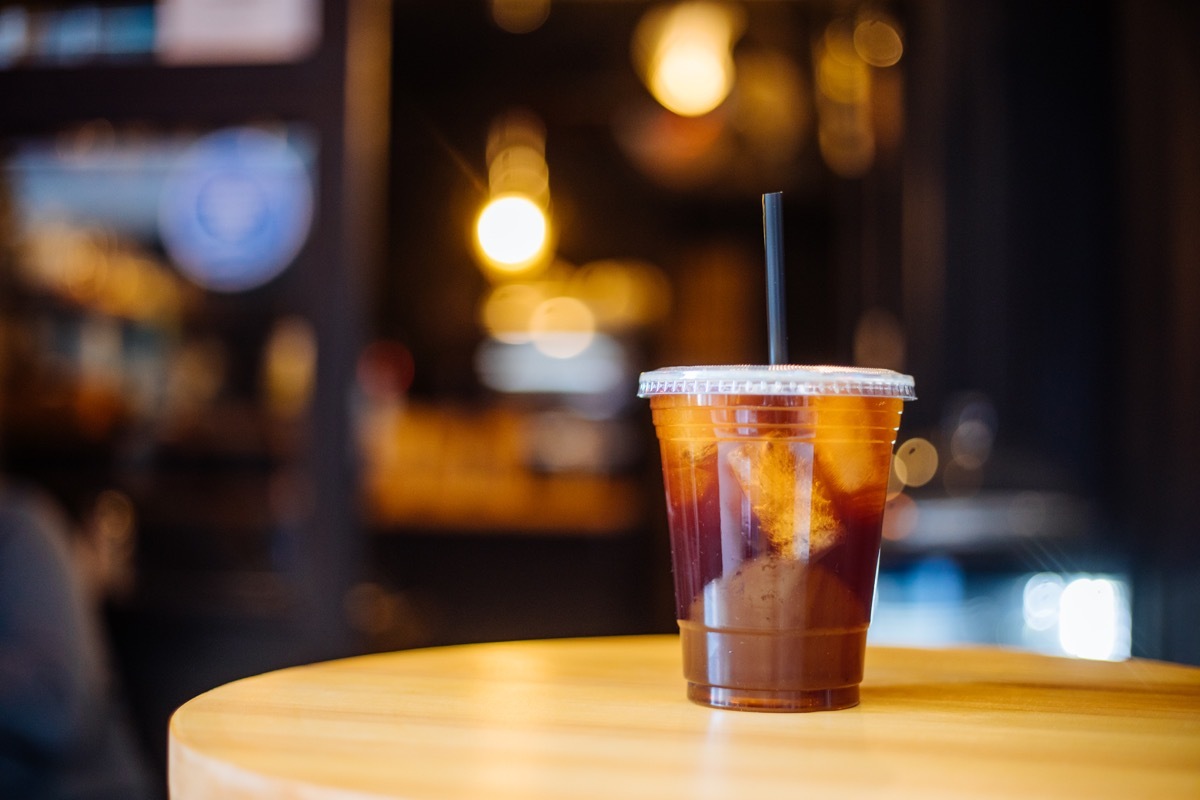 Take away iced coffee on table