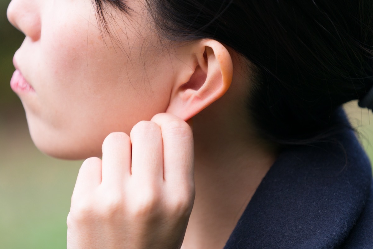 Woman with an ear massage