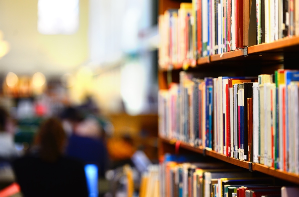 Books in public library, shallow DOF.