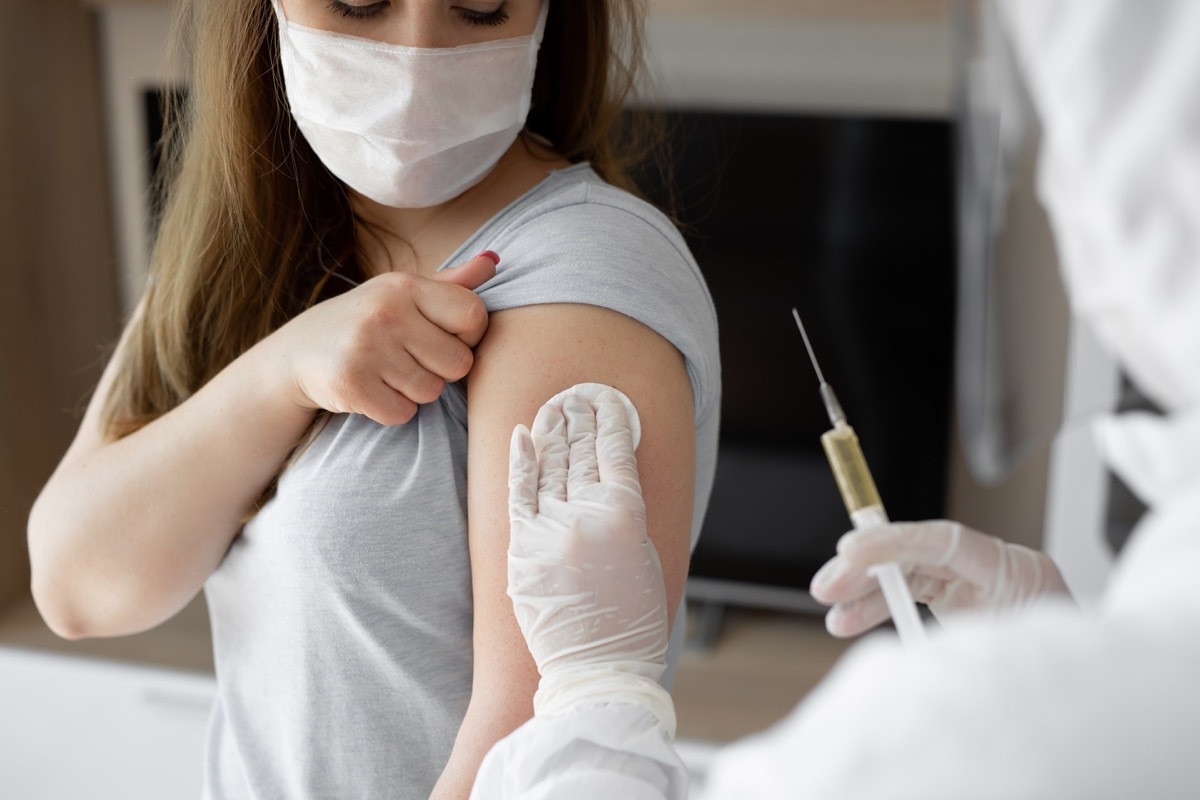 a doctor administers the COVID vaccine