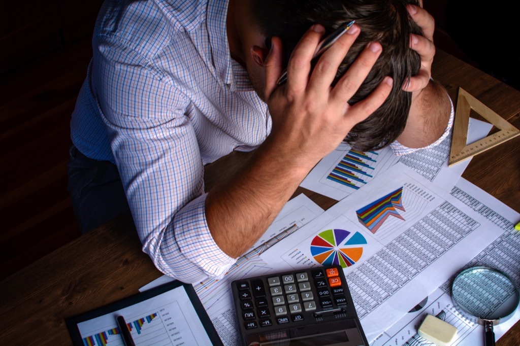 Stressed out man at work in the wrong job.