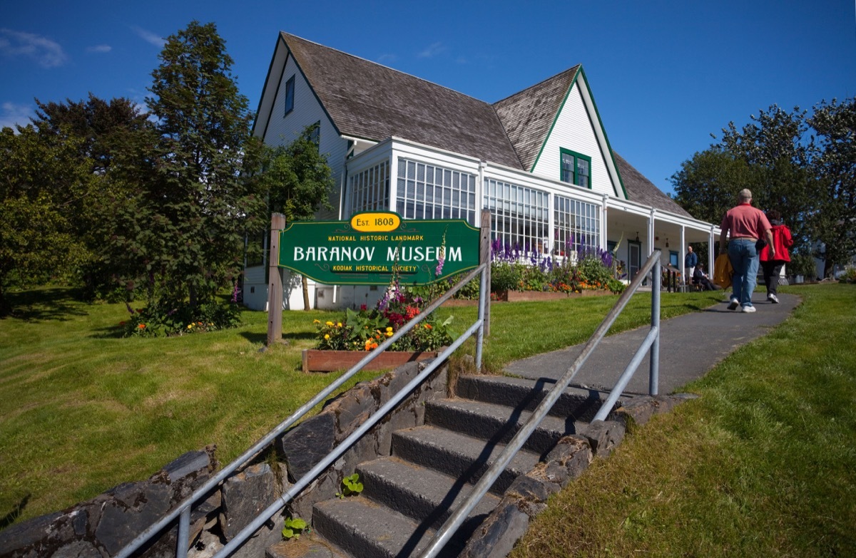 C52YYC Tourists visit the Baranov Museum in the Erskine House on a sunny day in Kodiak, Southwest Alaska, Summer