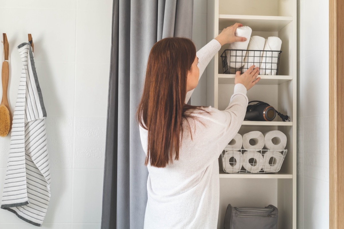 Woman with Organized Shelves