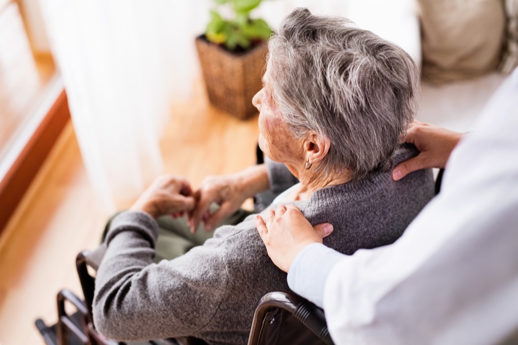 Woman getting a shoulder rub, just like George W. Bush gave to Merkel.