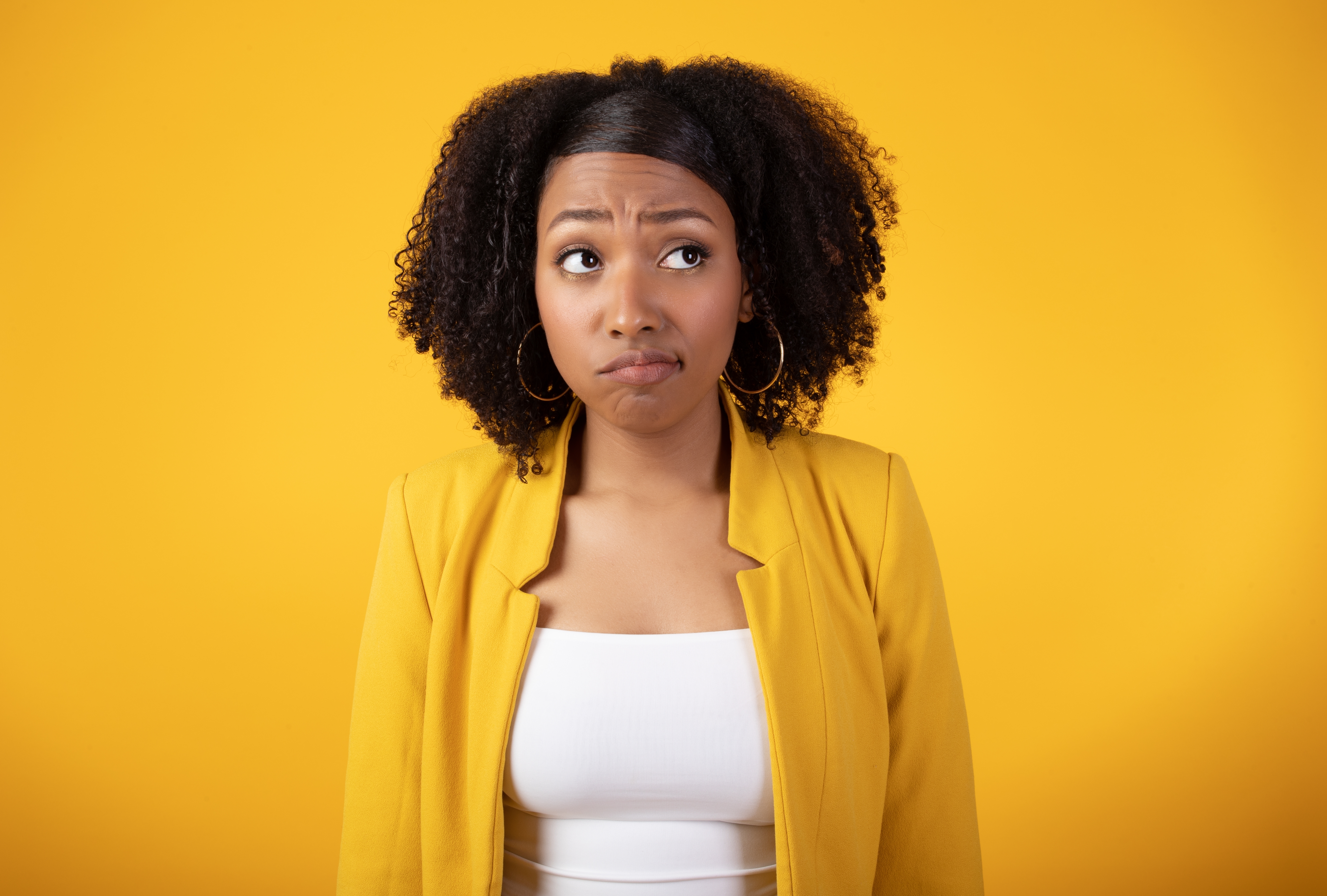 Woman wearing yellow unhappy