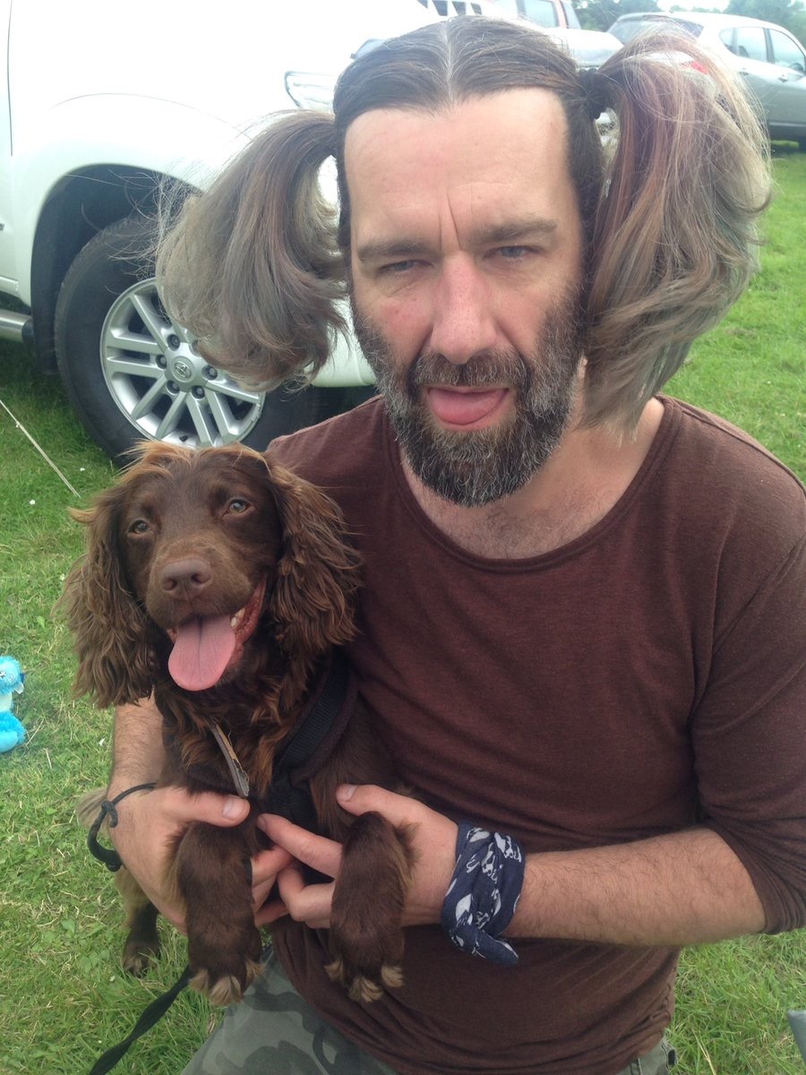 man looks just like his spaniel dogs who look like their owners